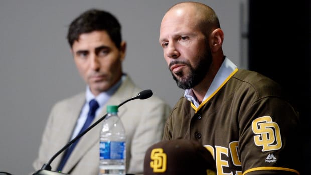 Oct 31, 2019; San Diego, CA, USA; San Diego Padres manager Jayce Tingler (right) is introduced as general manager A.J. Preller looks on at Petco Park. Mandatory Credit: Orlando Ramirez-USA TODAY Sports